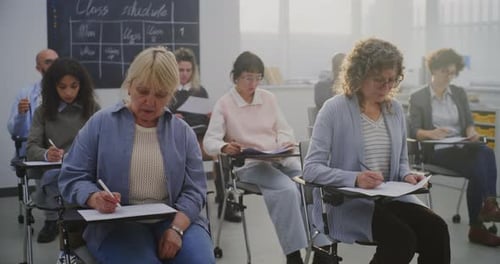 Adults Taking a Class in a Bright Classroom