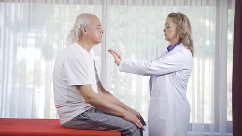 Doctor Examining Senior Patient in Medical Setting