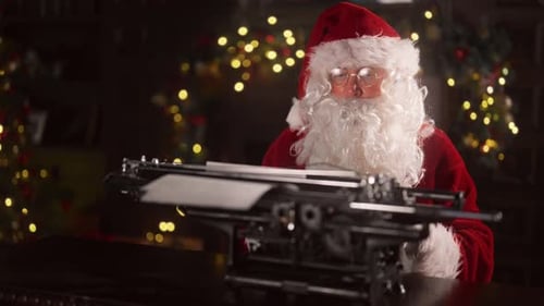Santa Claus Typing at Typewriter on Christmas