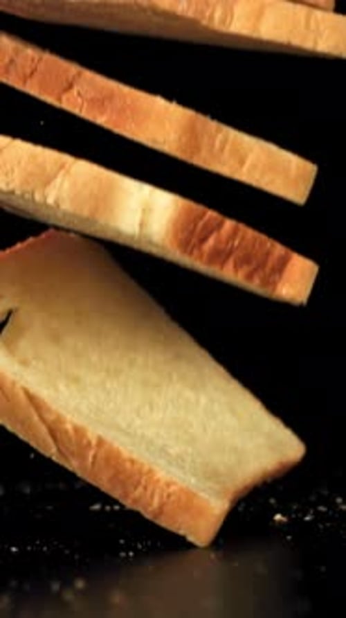 Pieces of Bread Fall on the Table Filmed on a Highspeed Camera at 1000 Fps