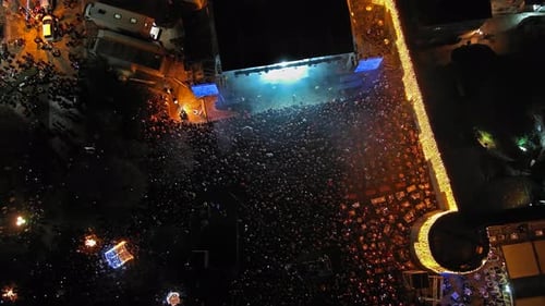 Massive Nighttime Concert, Aerial View of Energetic Crowd