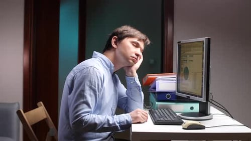 Tired Office Employee Falling Asleep at Work on Computer