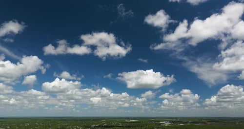 Aerial View of Puffy White Clouds and Blue Sky