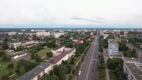 Aerial View of the Residential and Industrial Areas of the City and the Central Road with Heavy