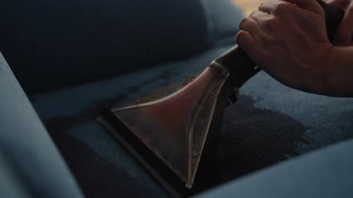 Couch Being Vacuumed