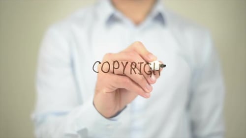 Writing the Word 'Copyright' with Marker