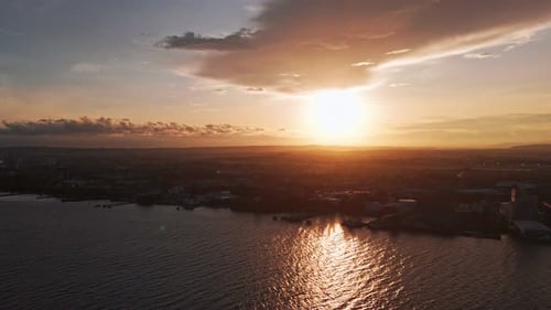 Drone Aerial View of City Coastline at Sunset in the Philippines