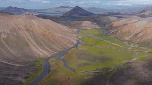 Aerial View of Iceland's Green Valley and Triangular Mountain