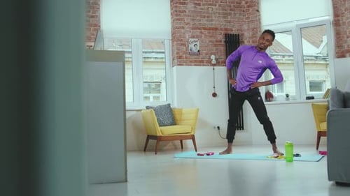 Man Doing Side Stretch Exercise at Home