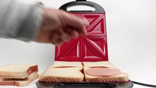 Person Making Simple Sandwiches in a Sandwich Maker