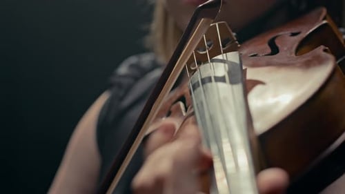 Woman Playing Violin in Close Up Detail
