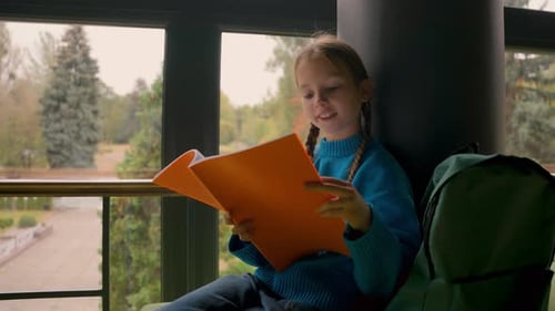 Little Girl Sitting School Hall Reading Textbook Prepare Exam Task Homework Lesson Indoors Education