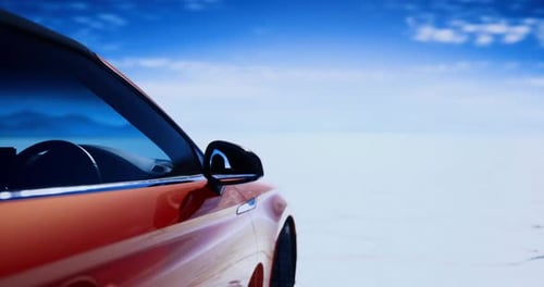 Modern Sports Car Driving on Vast White Landscape Under Blue Sky