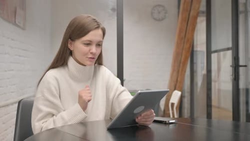Woman Video Calling with Tablet at Home