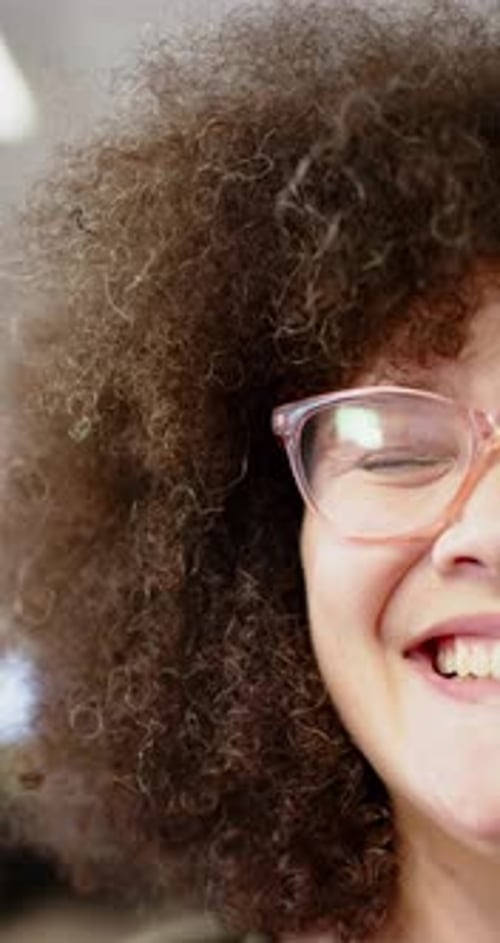 Close Up of Smiling Young Adult Woman with Curls