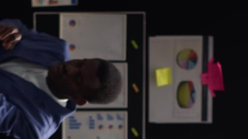 Professionals Collaborating on Data Analysis in an Office