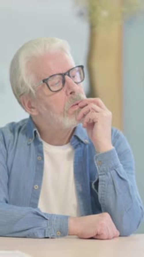 Brainstorming Old Man Thinking while Sitting in Office, vertical video