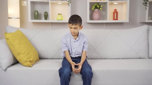 Boy afraid alone at home.