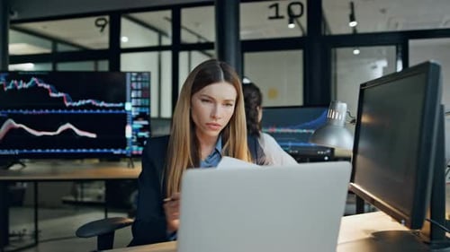 Finance Broker Working Computer at Investment Graph Focused Woman Analyze Stock