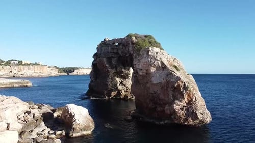 Ocean Stone Arch Formation Under Clear Skies