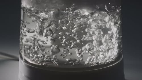 Boiling Water in Transparent Kettle Close Up