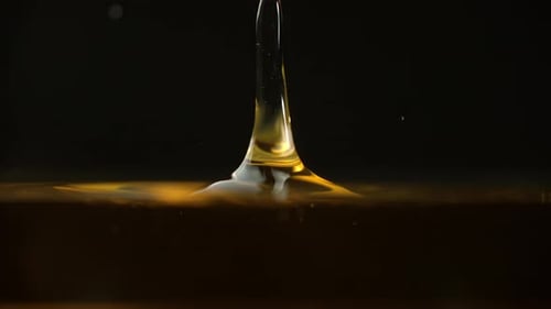 Gold Liquid Drop Crown Splash in Slow Motion