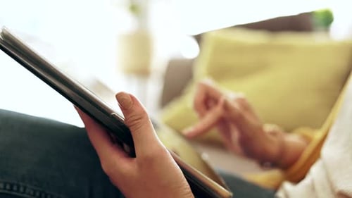 Close Up Of Person Using Tablet Indoors