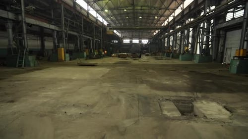 Empty Factory Floor Interior with Yellow Machinery