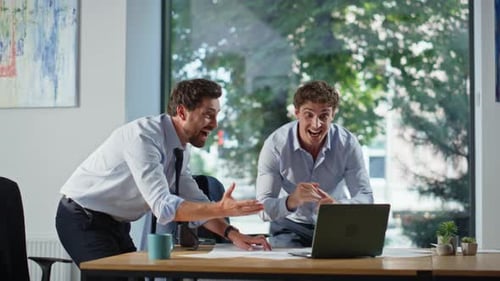 Overjoyed Business Winners Rejoicing Success with Excitement at Office Closeup