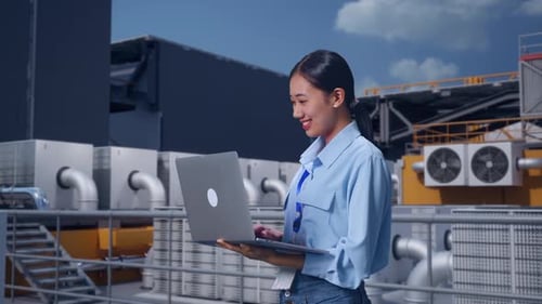 Asia Female Professional Worker Use Laptop On Rooftop HVAC