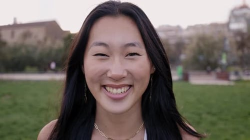 Portrait of a Woman Looking at Camera and Smiling Beautiful Girl is Happy and Cute and is Posing