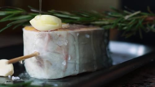 chef prepares a salmon dish in the kitchen. Close-up shots