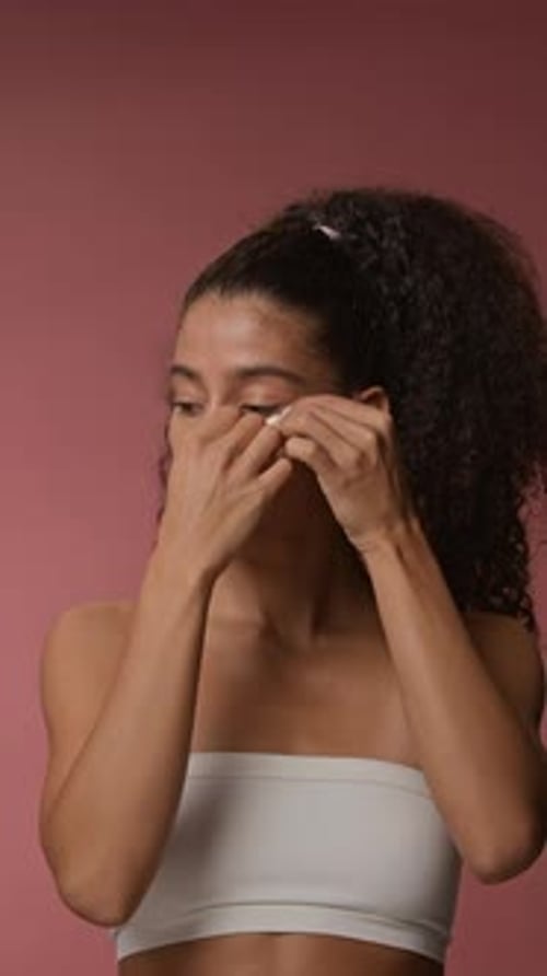 Woman Applies Eye Patches for Beauty Routine