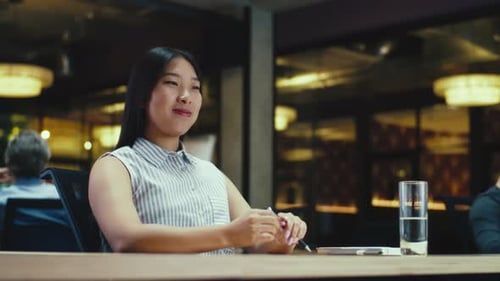 Female Office Worker Talking Via Video Call