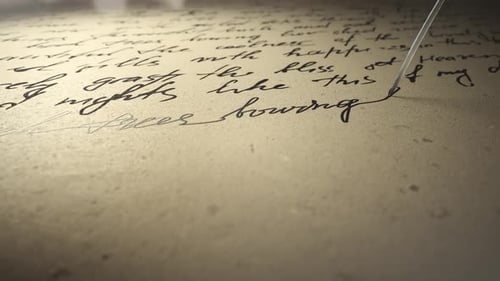 Quill Pen Writing on Aged Parchment