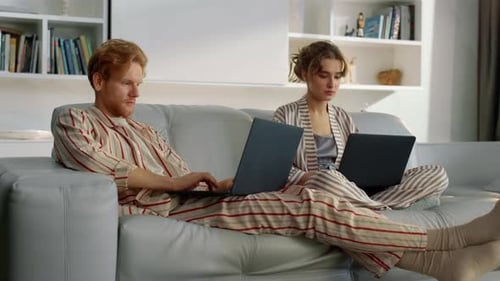 Serious Couple Working Home Together Closeup. Managers Browsing At Remote Office Typing Laptops. ...