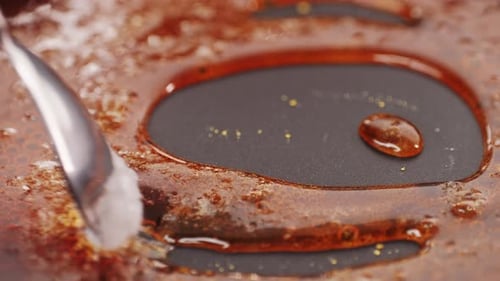 Close Up of Boiling Sugar with Bubbles Turns Into Caramel Caramelization Chef Cooking Dessert in