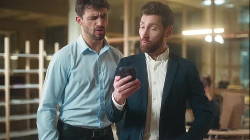 Caucasian Men Using Mobile Phone in Office Business App Coworkers Male Guys Smiling Businessmen