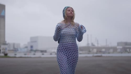 Stylish Woman Walking in Urban Setting