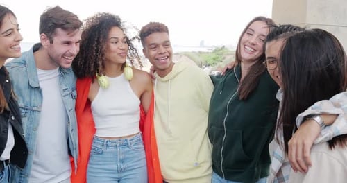 Group of Diverse Friends Hugging and Laughing While Having a Good Time Together