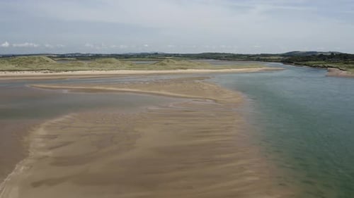 Large river sand bar revealed at low tide along Irish coast at Tramore
