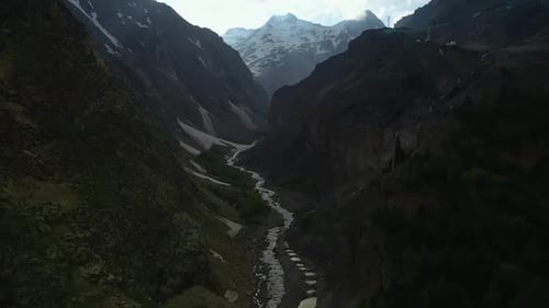Majestic River in Valley with Mountains and Trees