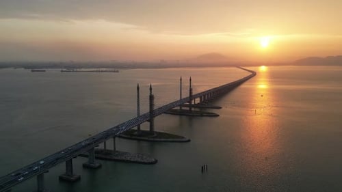 Aerial view golden sun over silhouette Penang Bridge