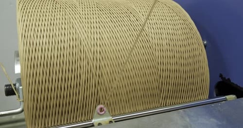 Industrial Machine Winding Rope Onto a Large Metal Spool Concept of Production Process in a Factory