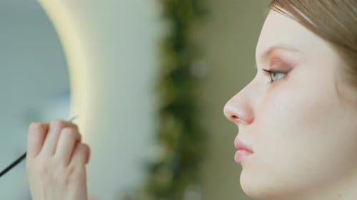 Makeup Artist Work in Her Beauty Studio Portrait of Woman Applying By Professional Make Up Master