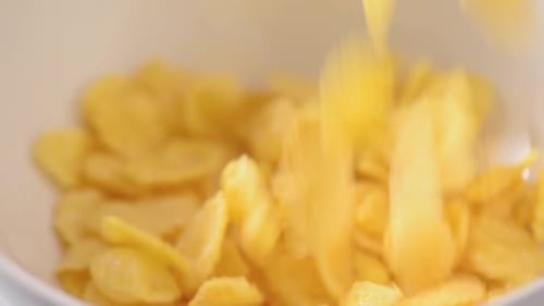 Cornflakes Falling into Bowl, Close Up