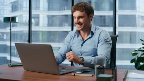 Young Businessman Rejoicing Profit Growth at Office Closeup. Happy Manager Satisfied Work