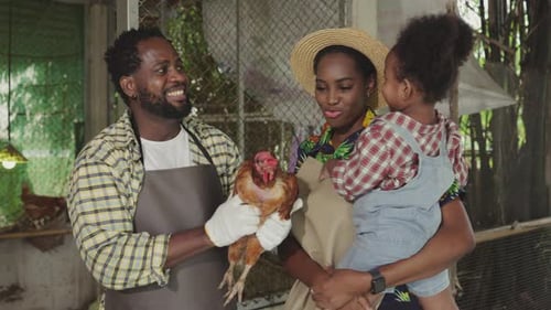 Happy farmer African family on livestock farm