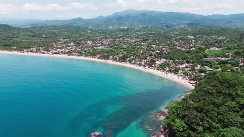 Lo de marcos showing crystal clear waters and sandy beach, a typical mexican village on the riviera