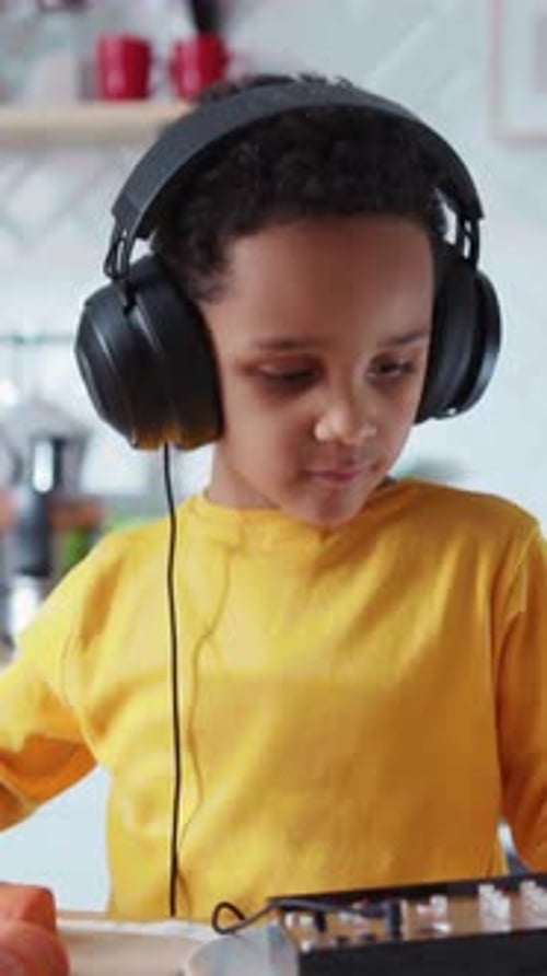 Cute Young Preschool Boy Playing on Child's Sound Mixer Using White Plates Performing Music in the